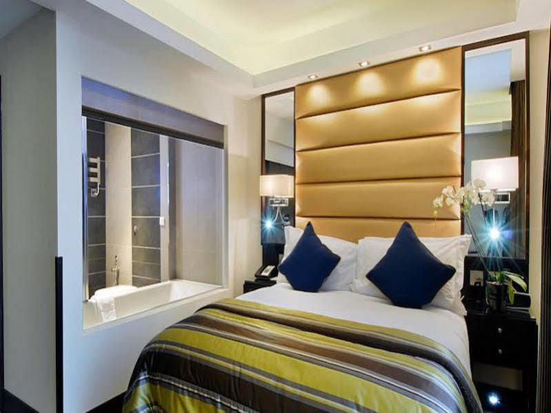 Park Grand Mayfair Londres Exterior foto A bedroom at the hotel